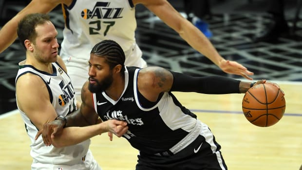 Feb 19, 2021; Los Angeles, California, USA; Utah Jazz forward Bojan Bogdanovic (44) defends Los Angeles Clippers guard Paul George (13) as he drives to the basket in the second half of the game at Staples Center. Mandatory Credit: Jayne Kamin-Oncea-USA TODAY Sports
